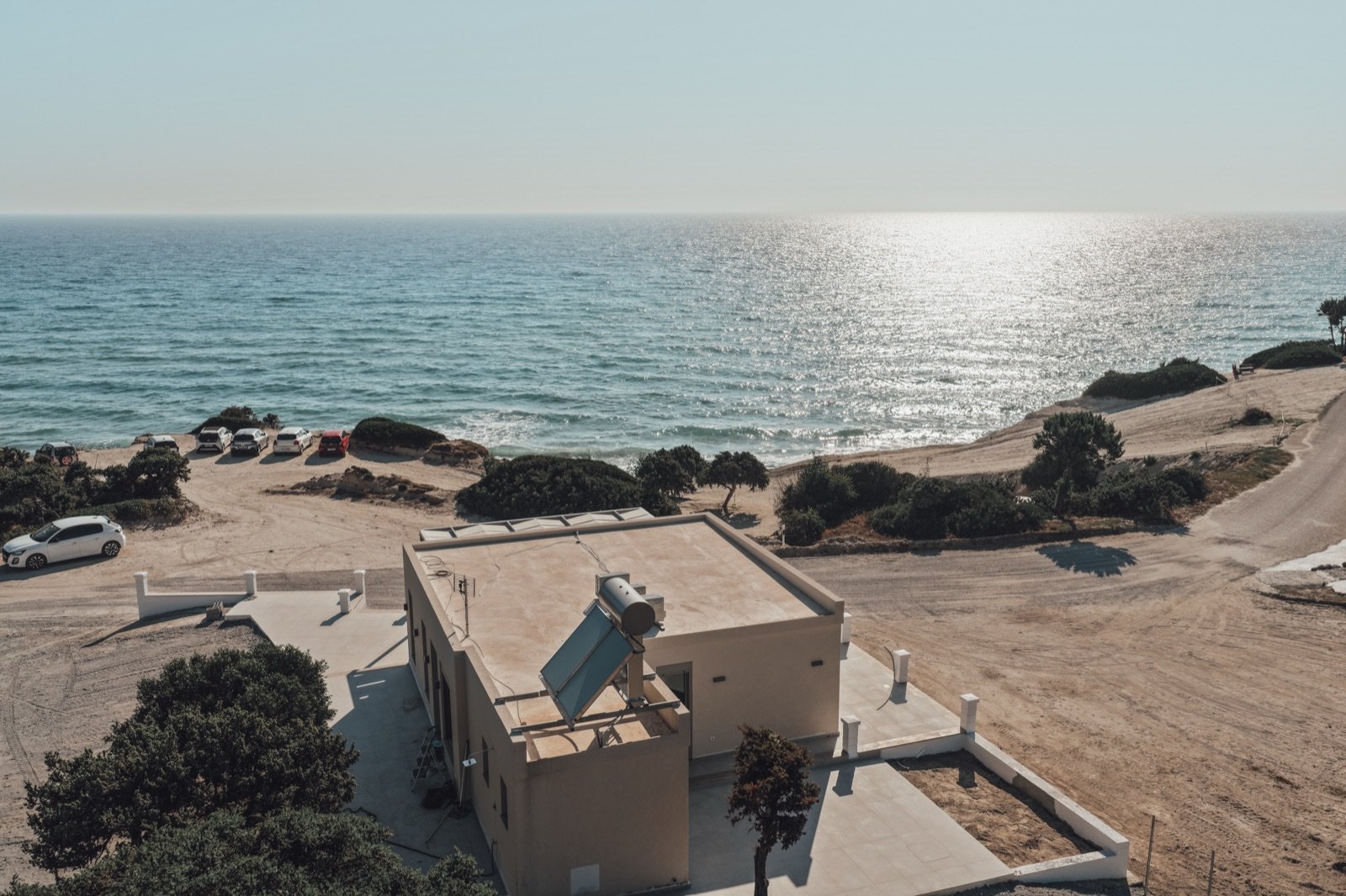 Villa Elusia from above at golden hour, alone on Agios Theologos Beach, Kos
