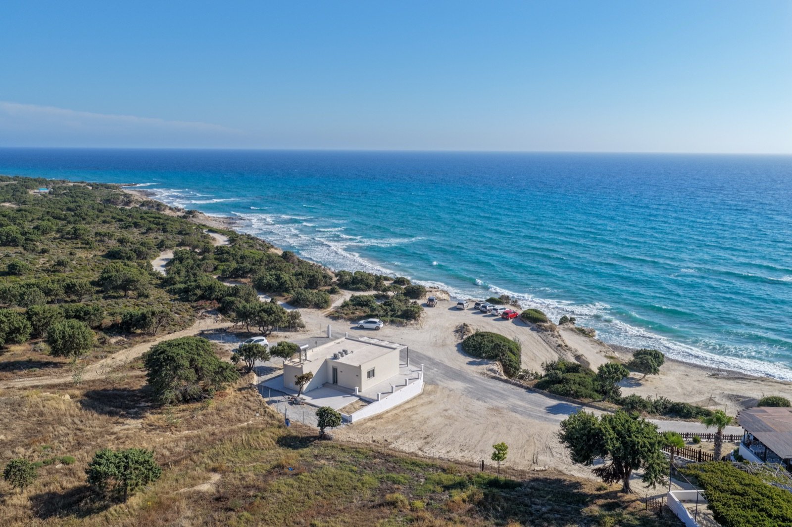 Aerial view of Villa Elusia and the turquoise sea of the west coast of Kos